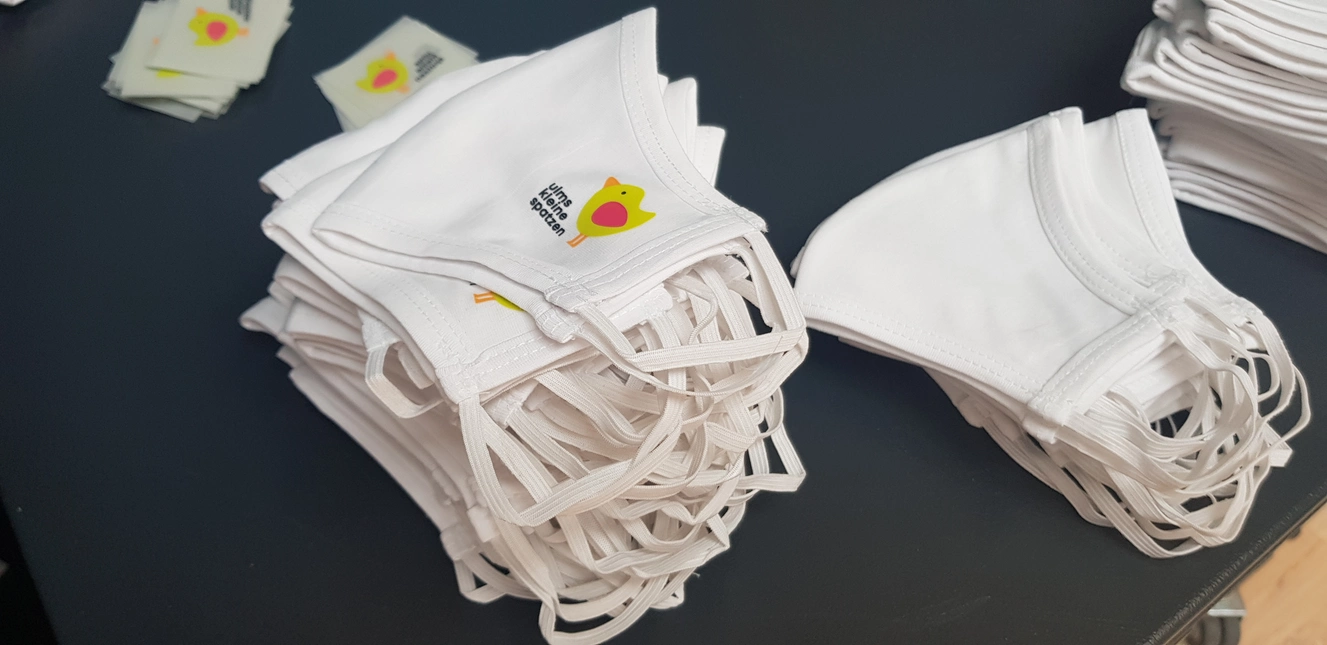Atemschutzmasken mit dem Ulms Kleine Spatzen Logo